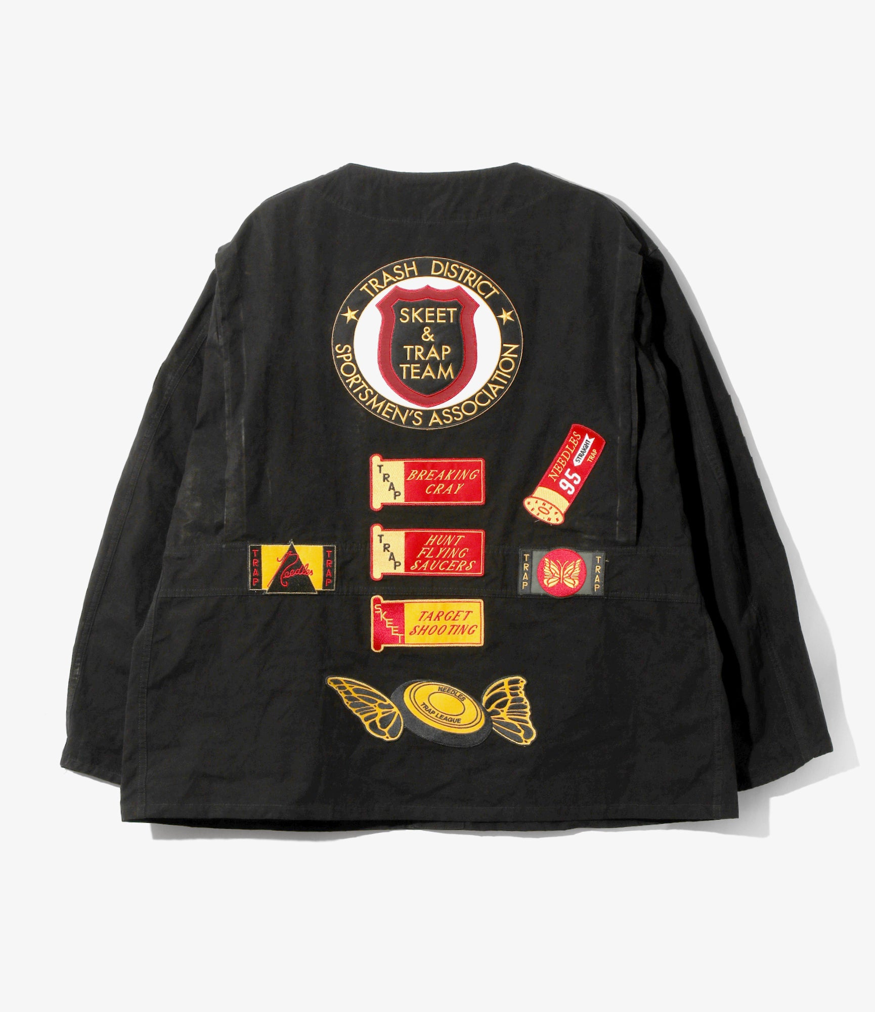 Black jacket with various patches on a white background